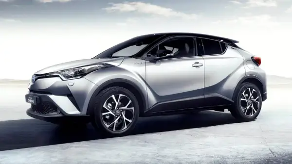 Silver Toyota C-HR hybrid, elegant design, ready for any journey. A stylish car, but some owners report a minor toyota chr problem with the infotainment system.